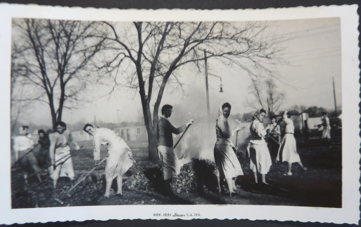 Image for Women With Scarves Raking Leaves